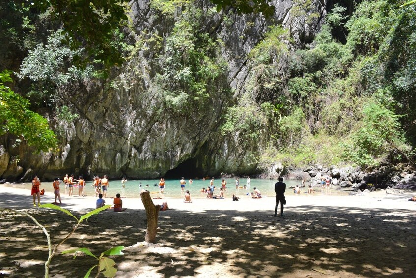 Group swimming through the Emerald Cave on Koh Mook