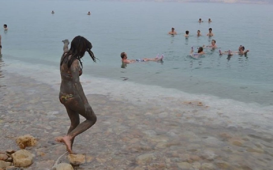 Group floating on the Dead Sea
