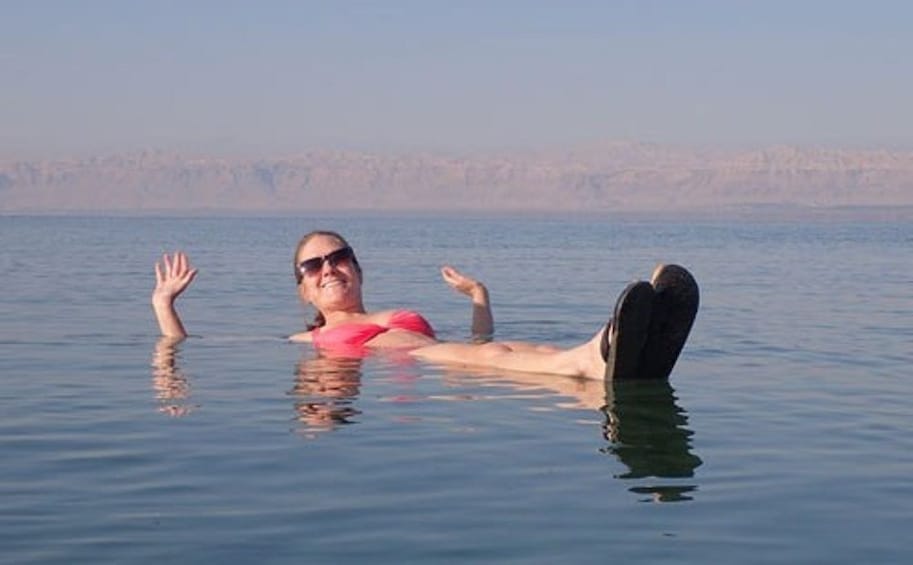Woman floating on the Dead Sea