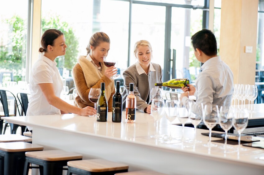 Women taste red wine at a Winery in Yarra Valley