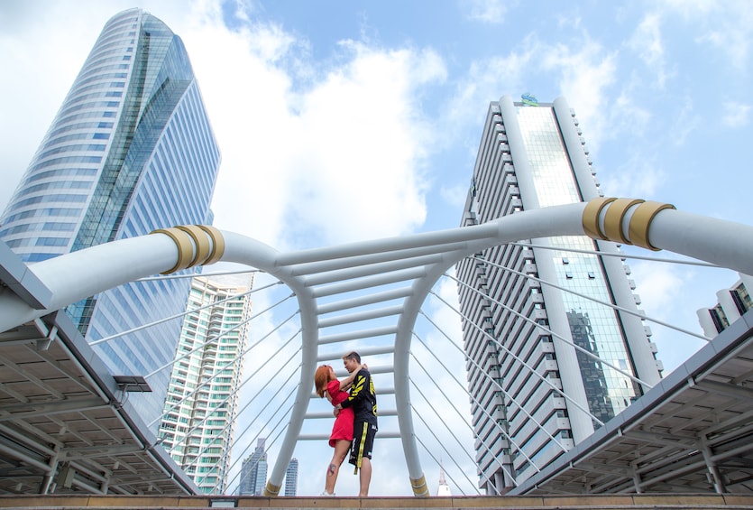 Show item 1 of 10. Couple on a bridge in Bangkok