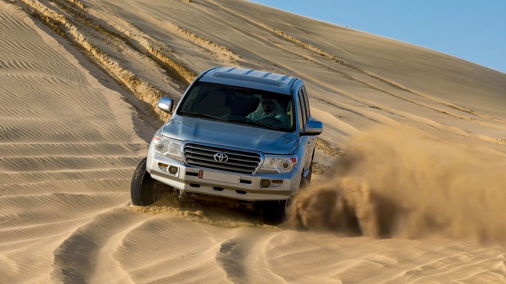 Jeep in sand dunes in Doha