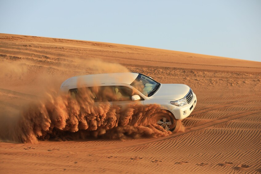 Doha: Sunset Desert Safari with Camel Ride and Sandboarding