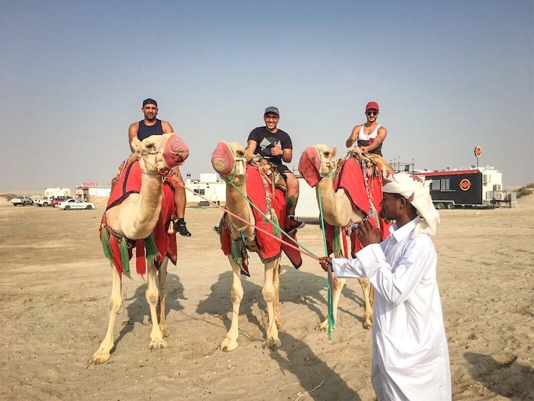 Doha: Sunset Desert Safari with Camel Ride and Sandboarding