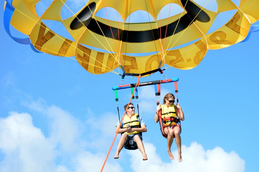 Man and woman parasail in Miami, Florida