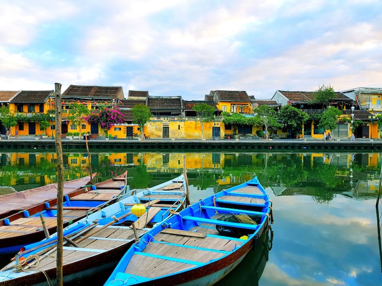 Wooden boats floating on the water of Hoi An Ancient Town