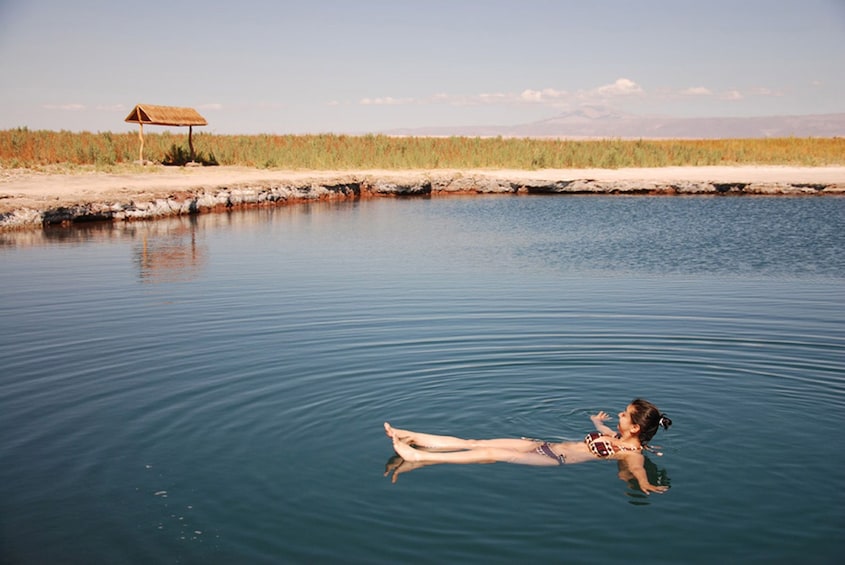 Show item 1 of 4. Woman bathing at Atacama in San Pedro de Atacama