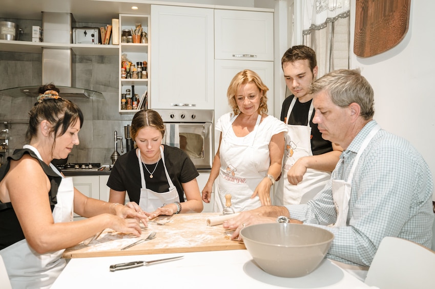 Private Market Tour + Cook + Dine in a local home in Bologna