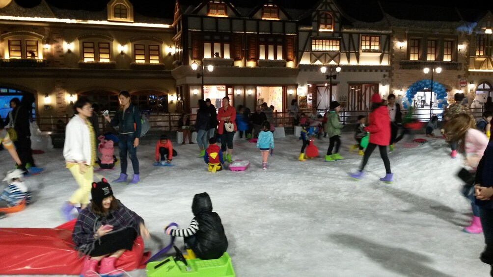 Group playing in the snow at Dreamworld Theme Park in Bangkok