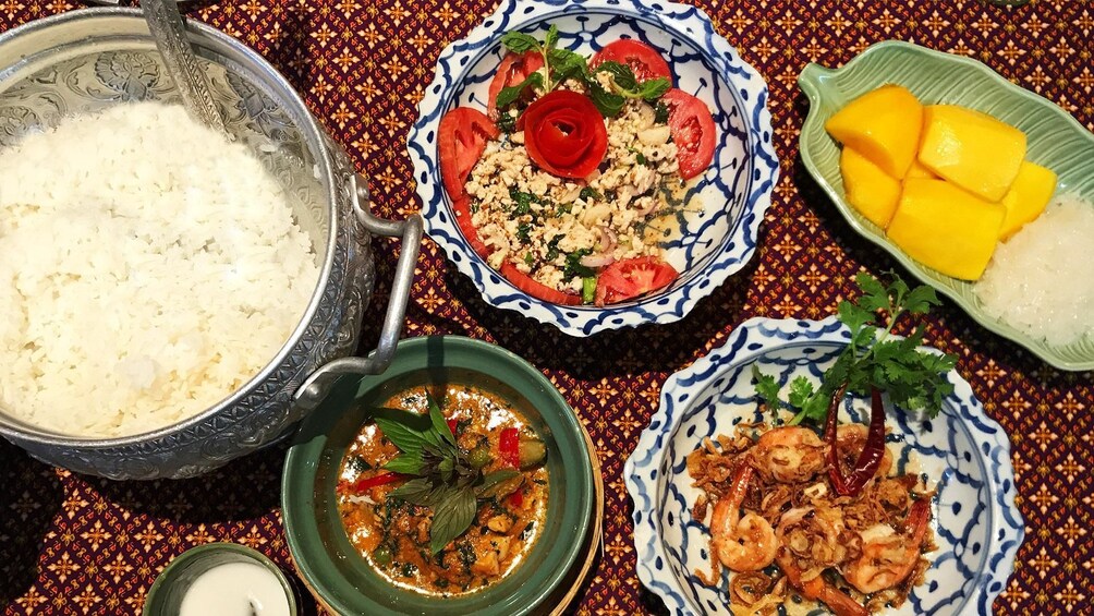 Table full of Thai dishes at Sompong Thai Cooking School in Bangkok