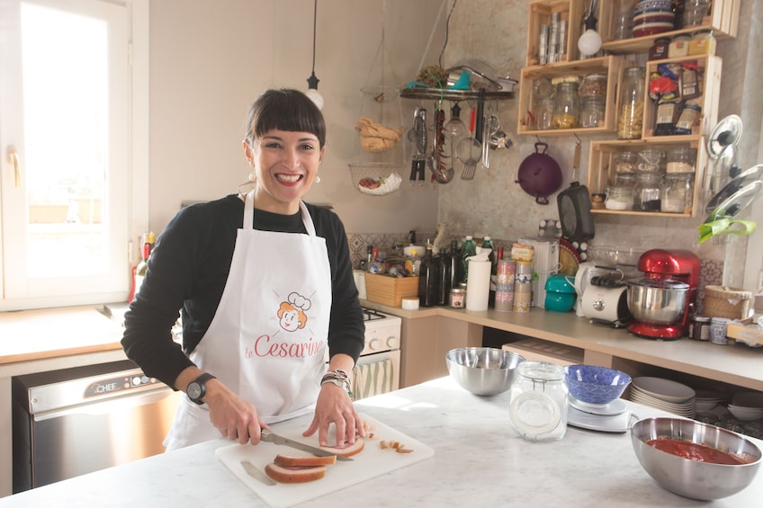 Woman preparing food in a kitchen in Verona