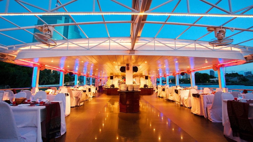 View of the seating area and buffet line aboard the Chao Phraya Princess Cruise