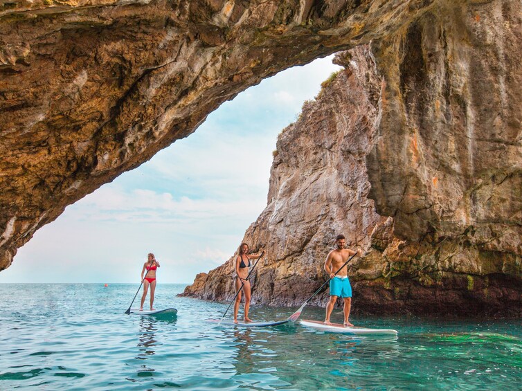 Paddleboarders navigate through channel on Islas Marietas 