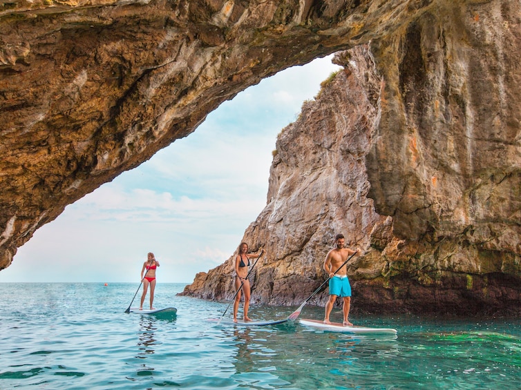 Paddleboarders navigate through channel on Islas Marietas