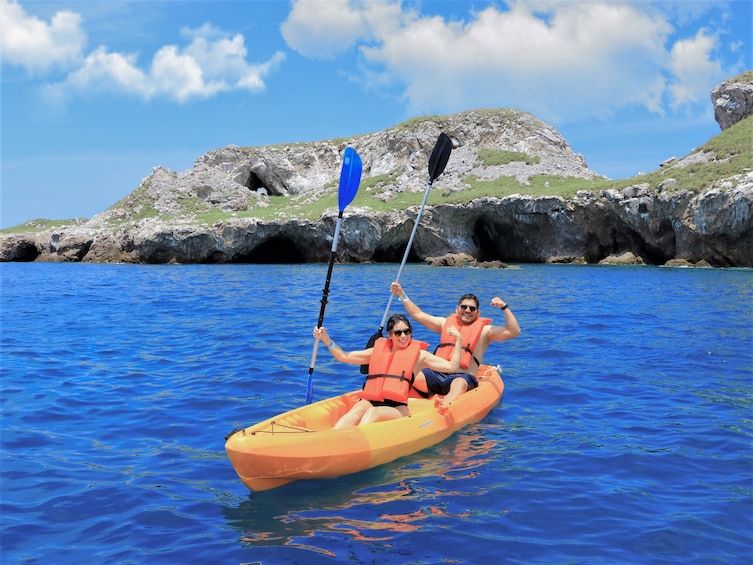 Kayaking couple in water in Puerto Vallarta
