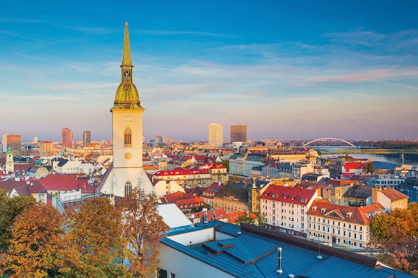 View of Bratislava old town with St. Martins Cathedral and Danube River at dusk