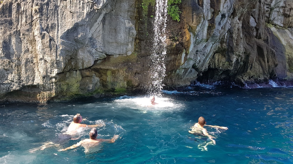 Show item 4 of 10. Visitors swimming in the crystal clear Mediterranean waters