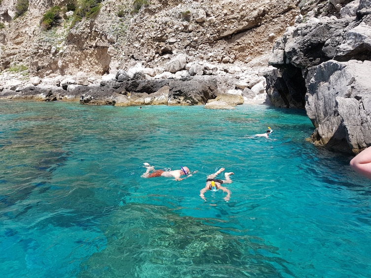 Show item 2 of 10. Tourists swim in Blue Grotto in Capri, Italy