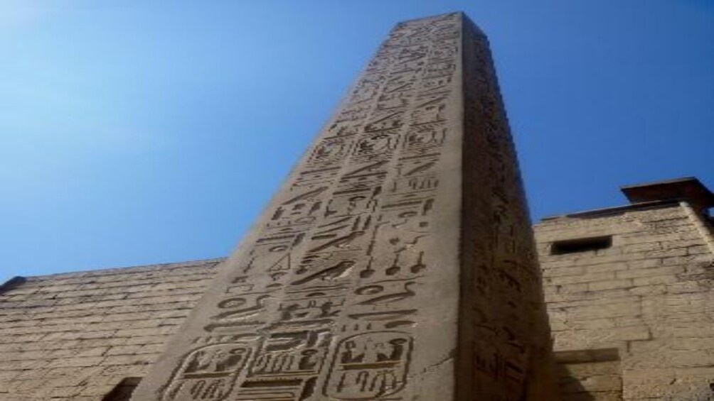 View up a carved Luxor temple on a sunny day