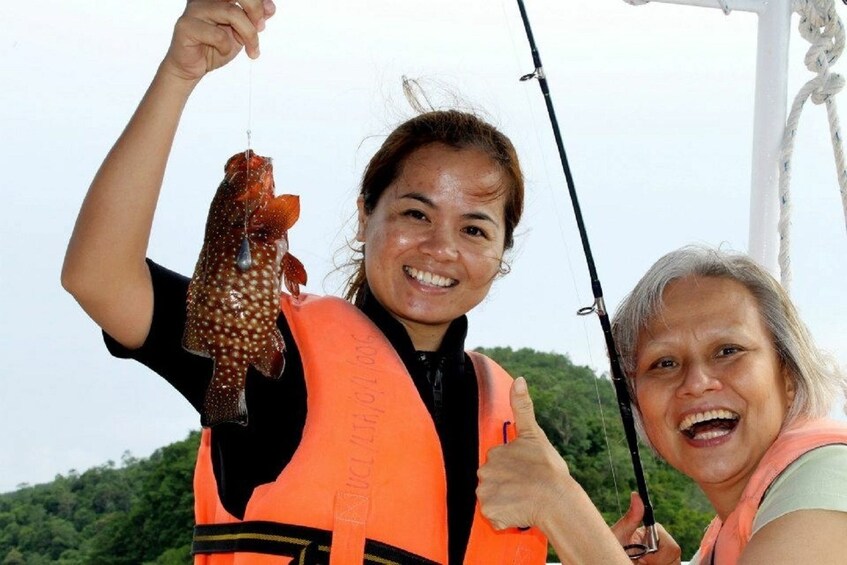 Women enjoying fishing at the waters off the coast of Kota Belud

