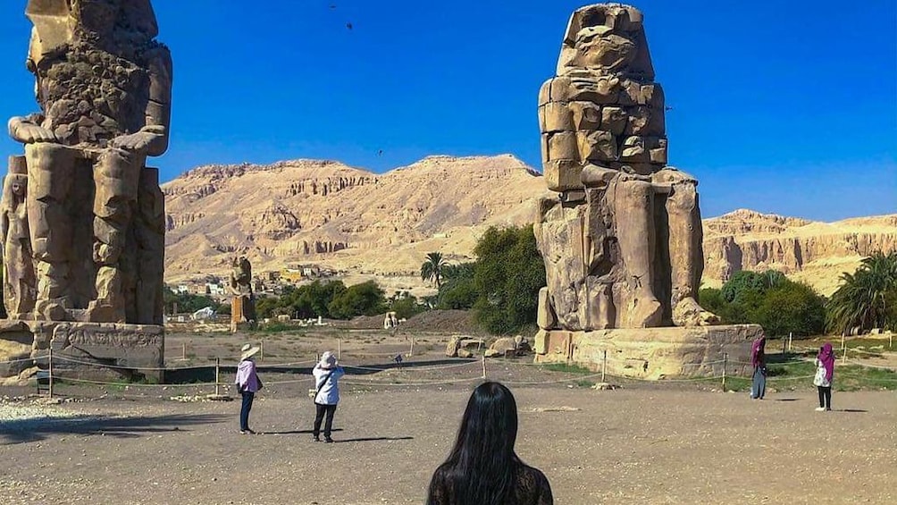 Tourists at Colossi of Memnon in Luxor, Egypt