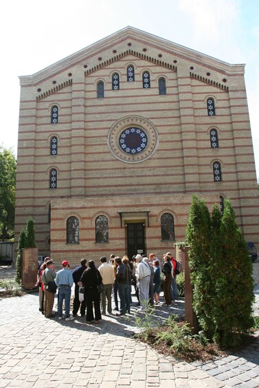 People stand outside of Budapest Synagogue