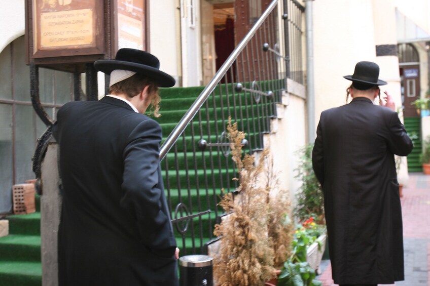 Hasidic Jews walk down street in Budapest, Hungary