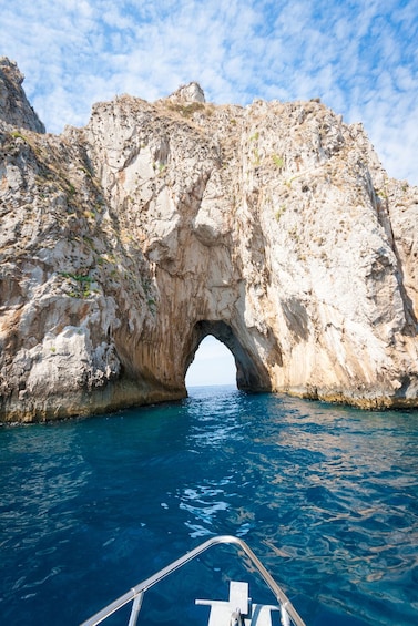 Rock tunnel on the water off the coast of Italy