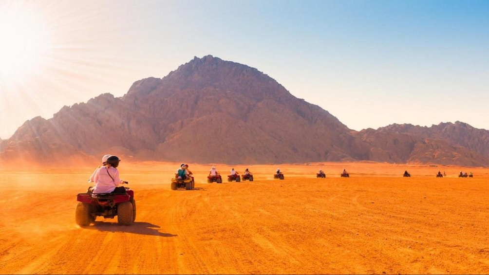 Line of dune buggies drive through Hurghada Desert in Egypt
