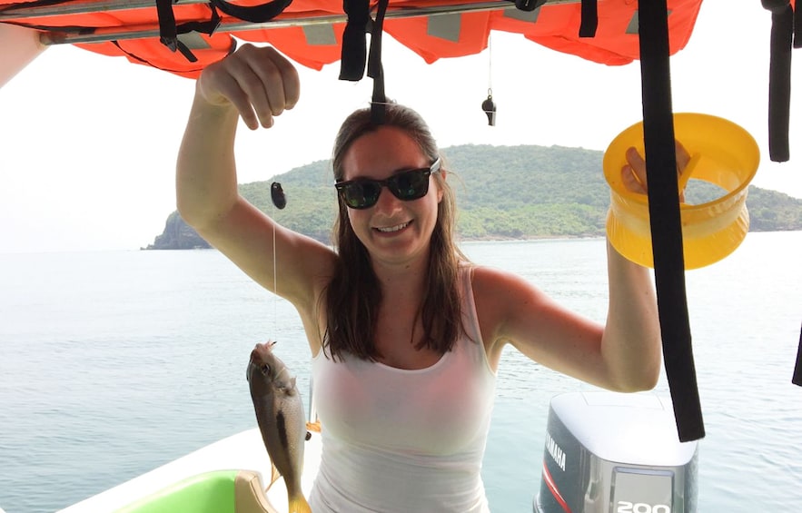 Show item 5 of 5. Woman fishing on Phu Quoc Island