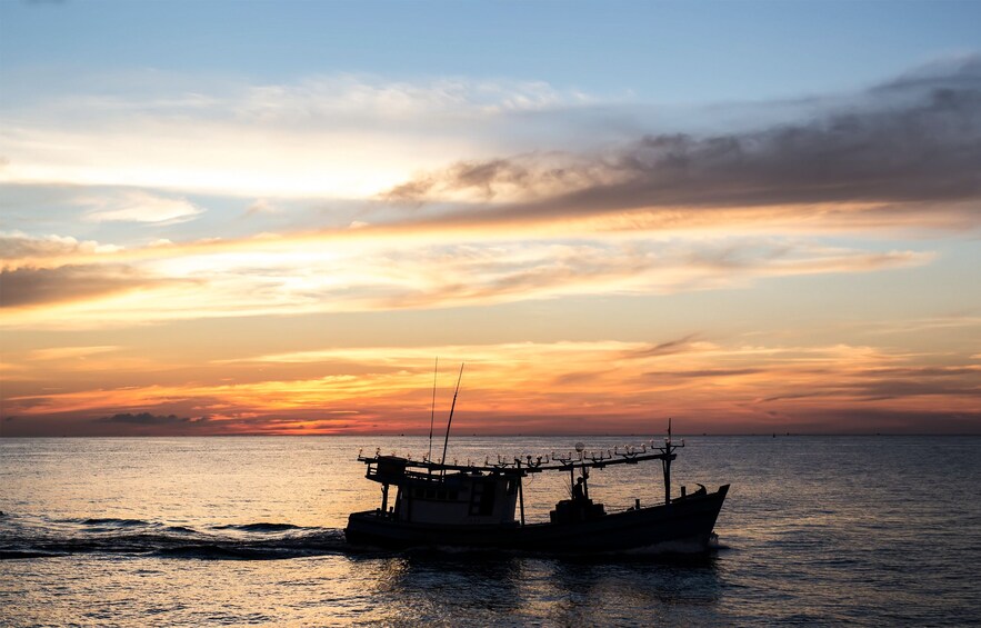 Panoramic view of boat on water in Vietnam at sunset