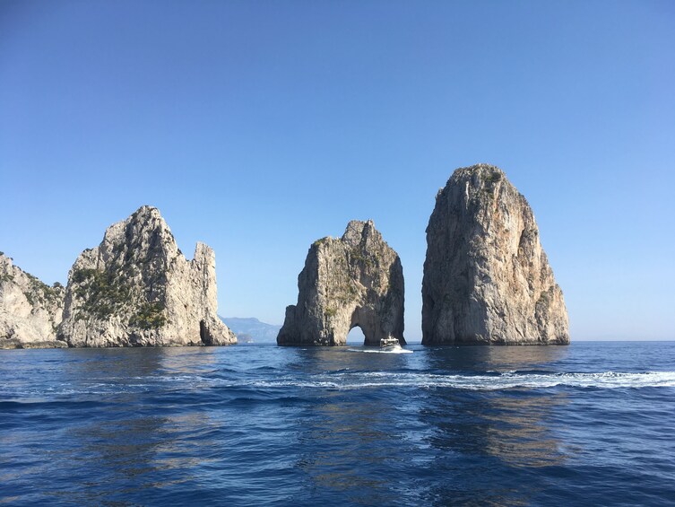 Show item 3 of 10. Faraglioni rock stacks in sea near Capri, Italy