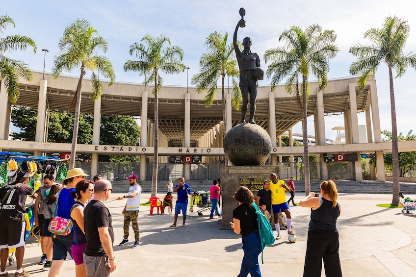 Tourists in plaza outside of Estadio Mario Alberto Kempes stadium in Rio de Janeiro, Brazil