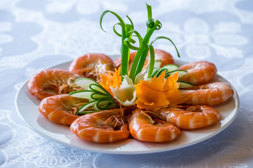 Closeup on plate of shrimp with garnish