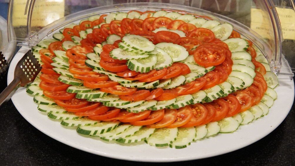 Tray of tomato and cucumbers offered on a tour in Vietnam