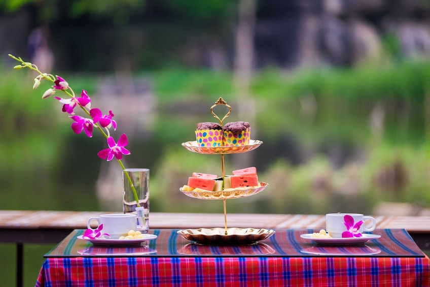 Closeup of afternoon tea with orchid in a tall glass in Vietnam