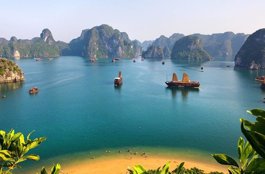 Aerial view of beach and boats in Halong Bay