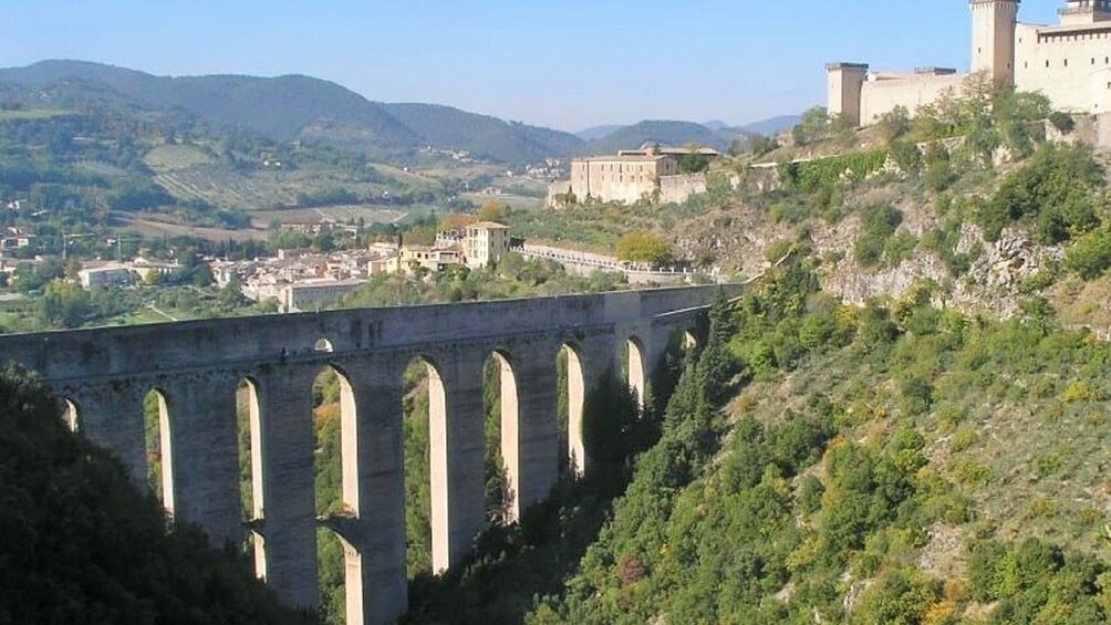 Ponte delle Torri over ravine with view of village 