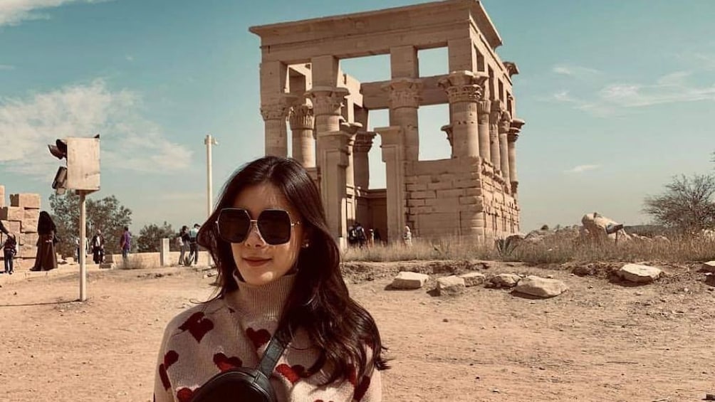 Woman poses in front of Temple of Kom Ombo