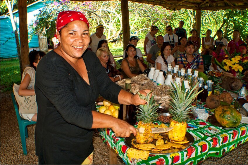 Woman preparing a pineapple in Punta Cana 