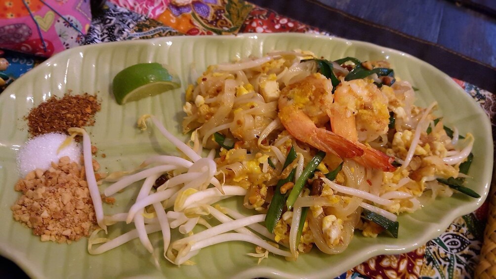 Green dish with shrimp pad thai