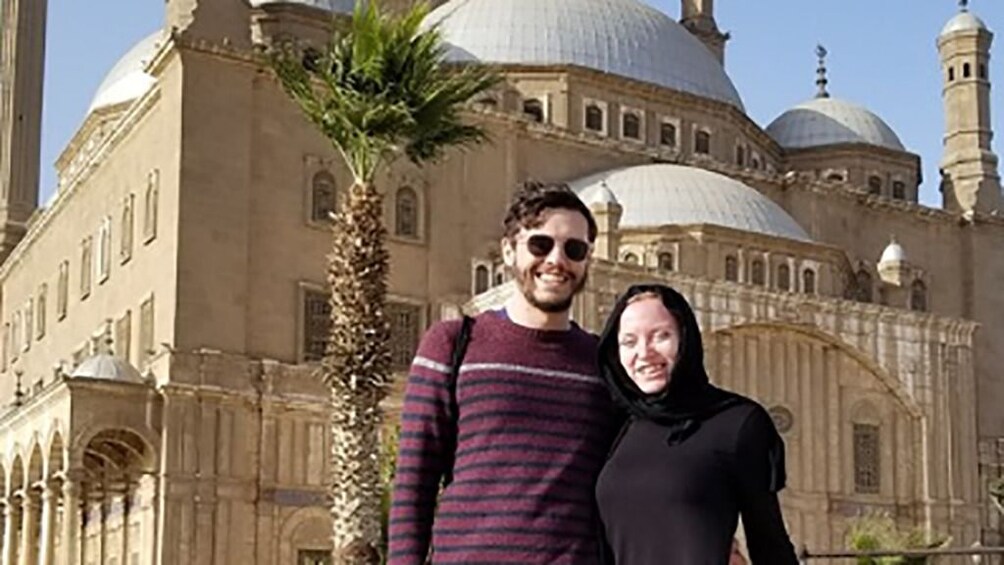 Couple pose in front of the Mosque of Muhammad Ali