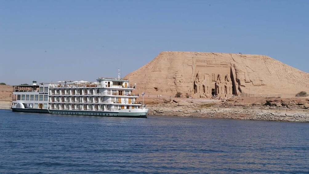 Large cruise ship on Lake Nasser with Abu Simbel Temples in the background