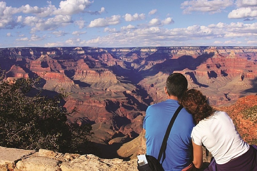 Couple enjoying a view of the Grand Canyon