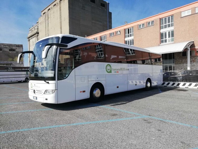 Show item 5 of 10. Parked Tuscany Bus