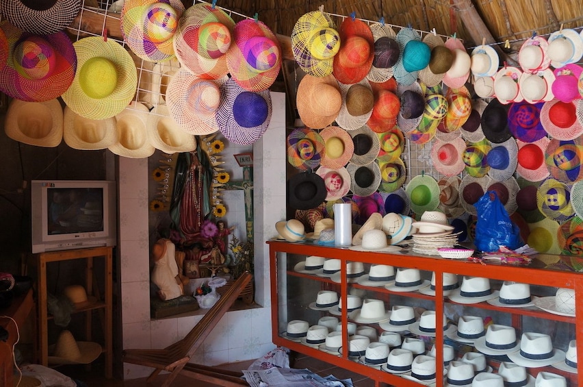 Colorful hats on walls and in display case in shop in Campeche, Mexico