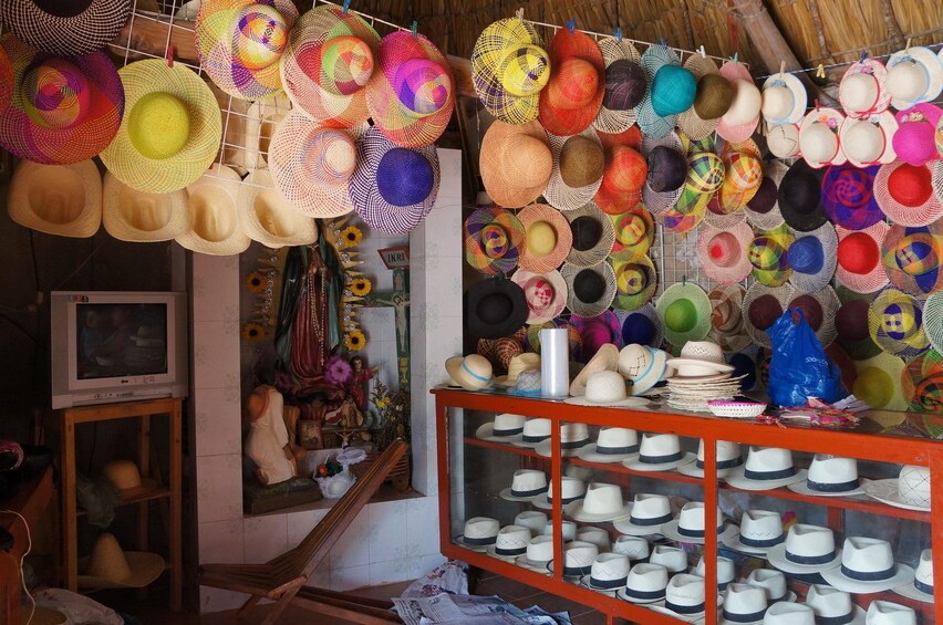 Colorful hats on walls and in display case in shop in Campeche, Mexico