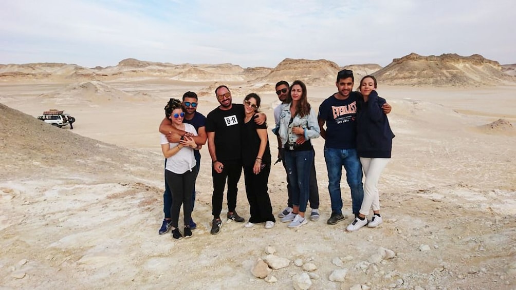 Tourists pose together in the White Desert in Egypt