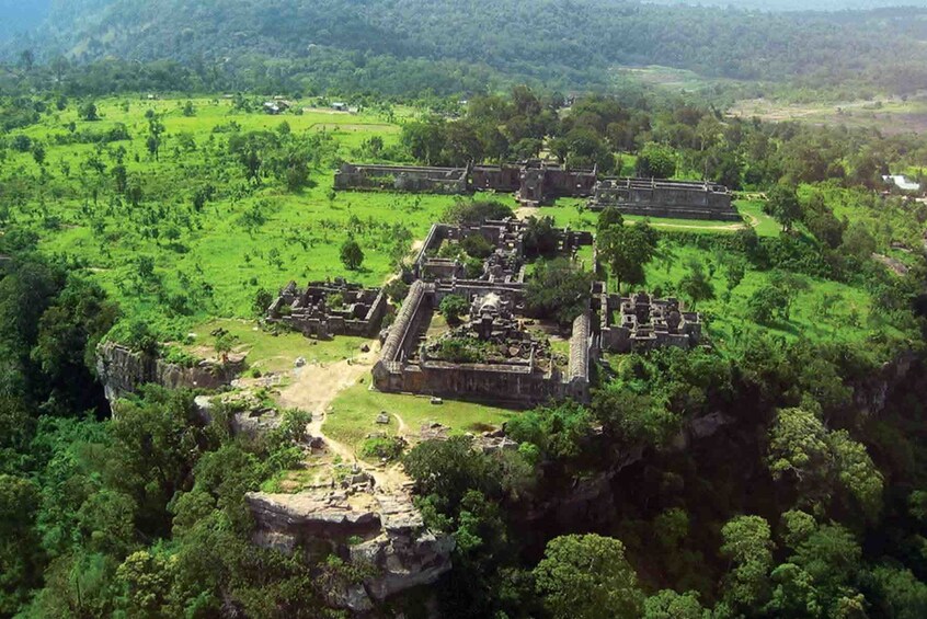 Aerial view of lush Cambodian landscape and Preah Vihear Temple