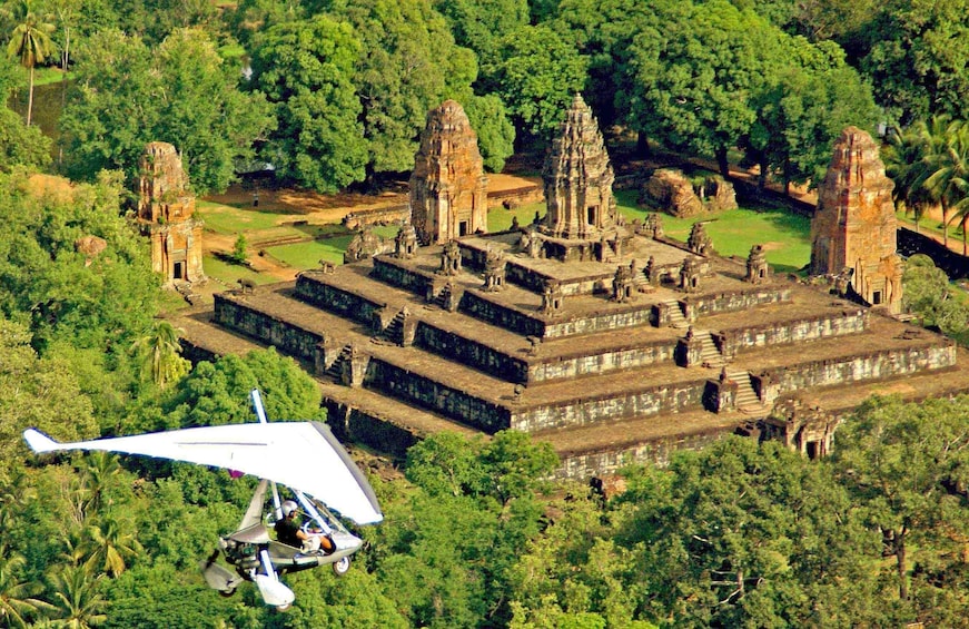 Helicopter over Angkor Wat Temple Complex in Cambodia